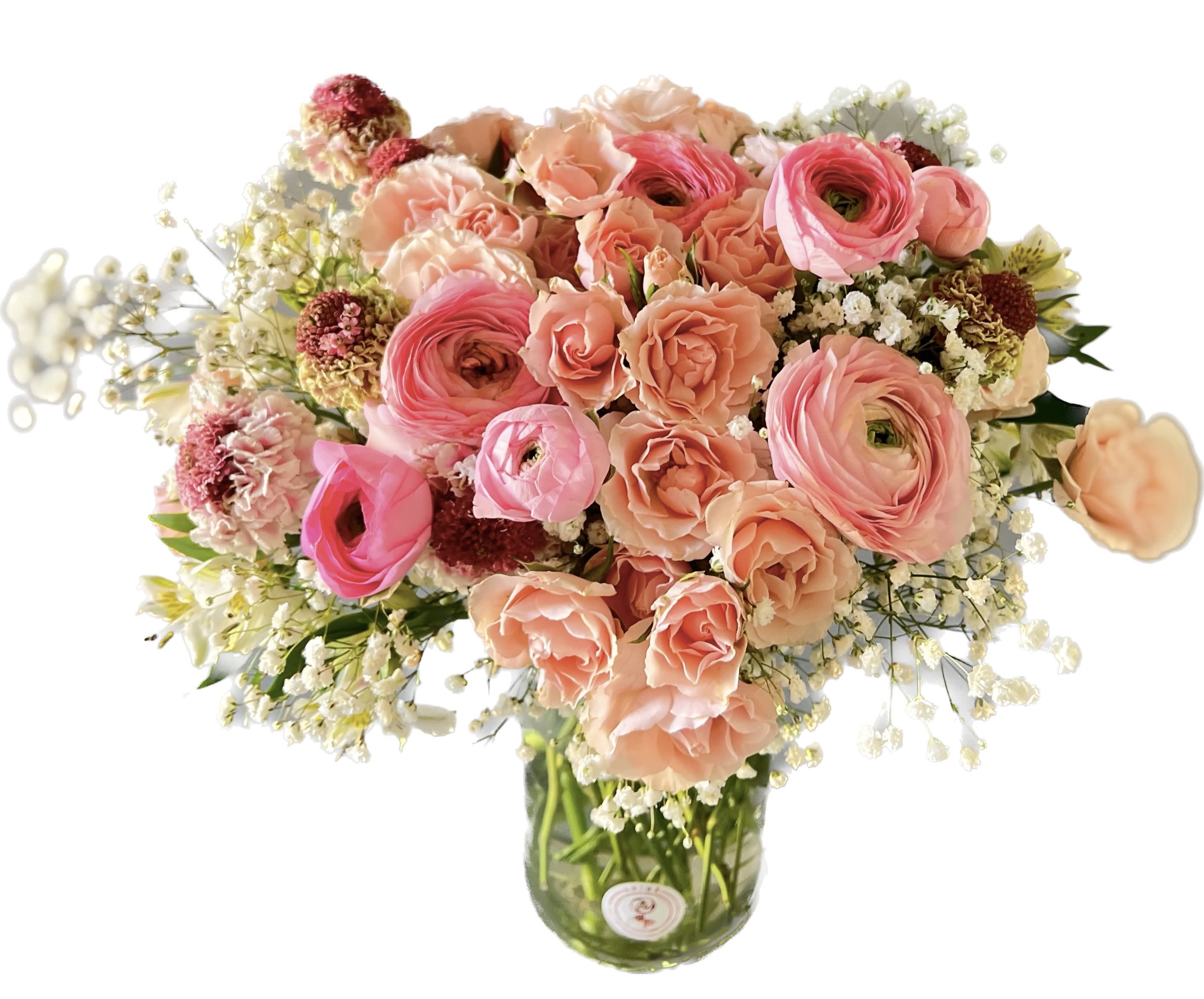 Pink and peach mixed bouquet in a glass vase