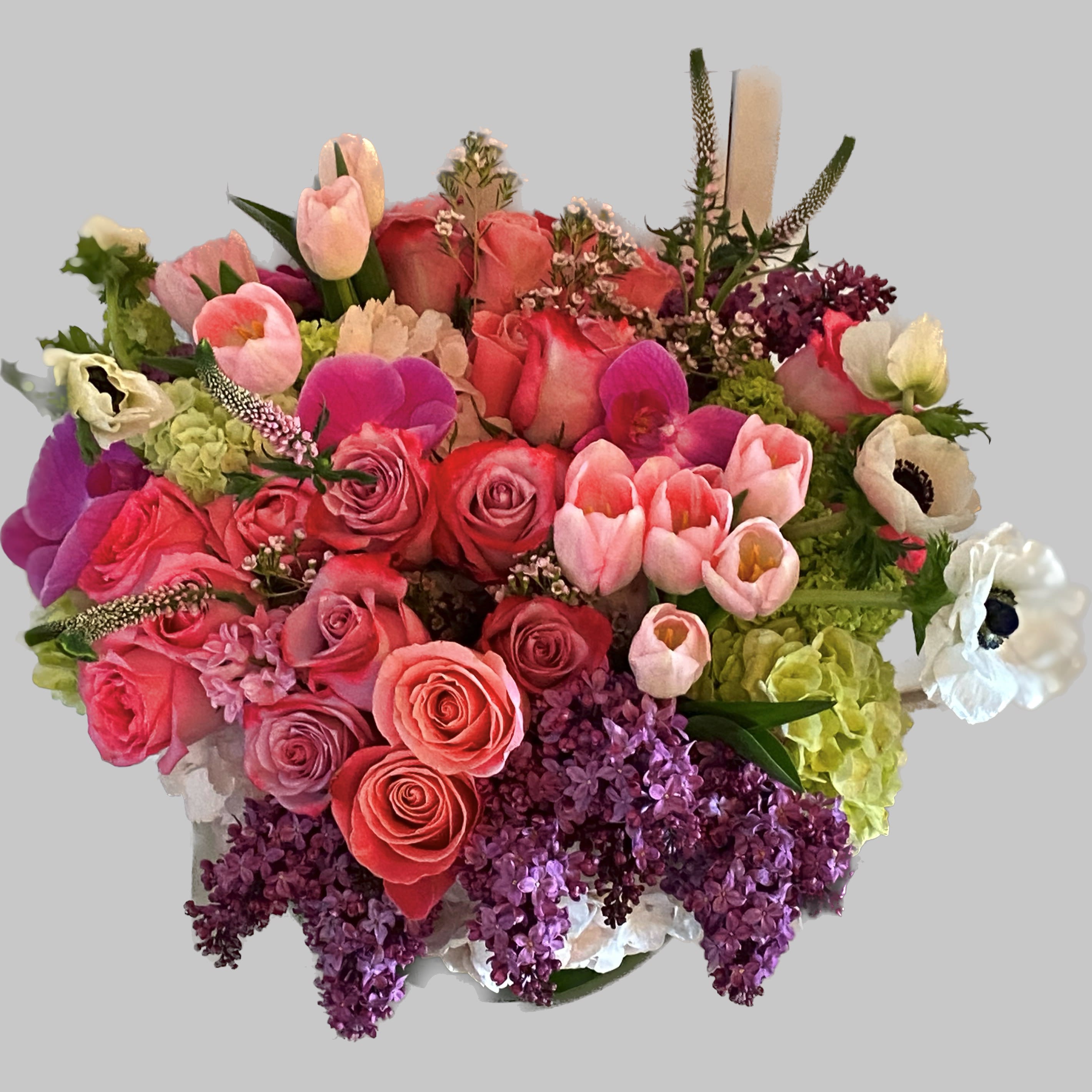 Mixed bouquet of pink, coral, purple, and white flowers