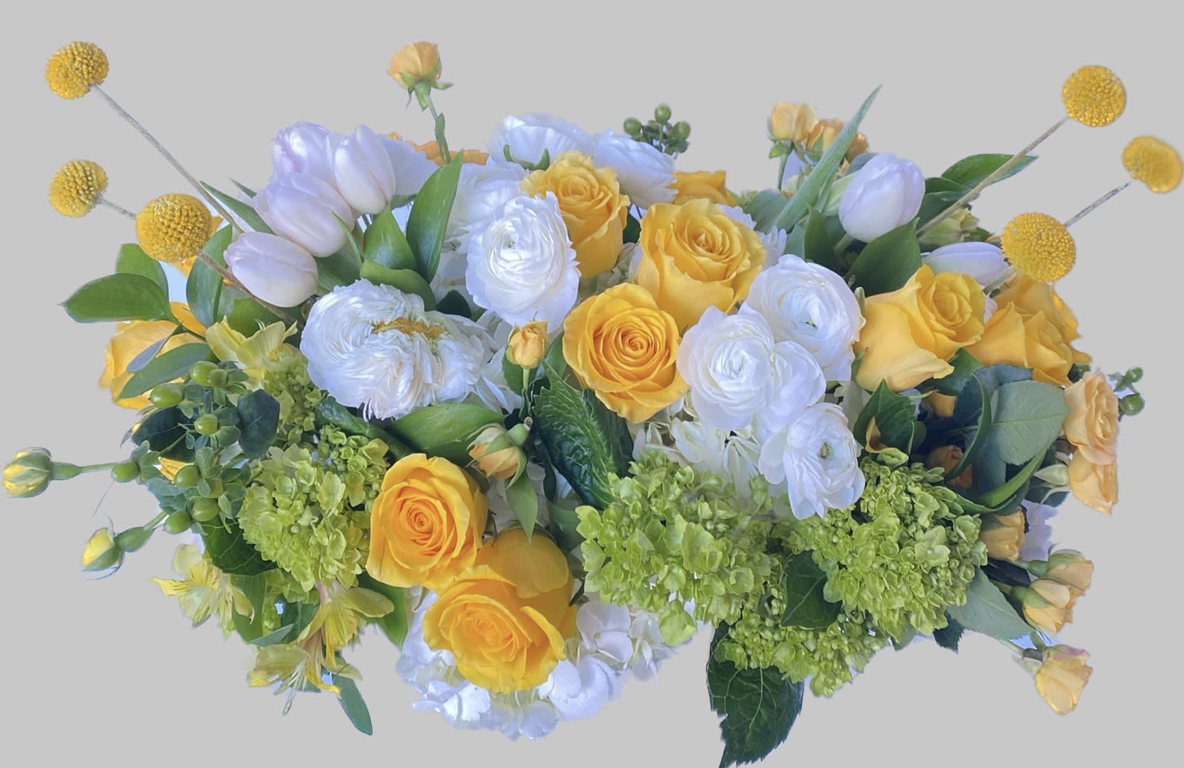 Yellow and white floral arrangement with roses and tulips
