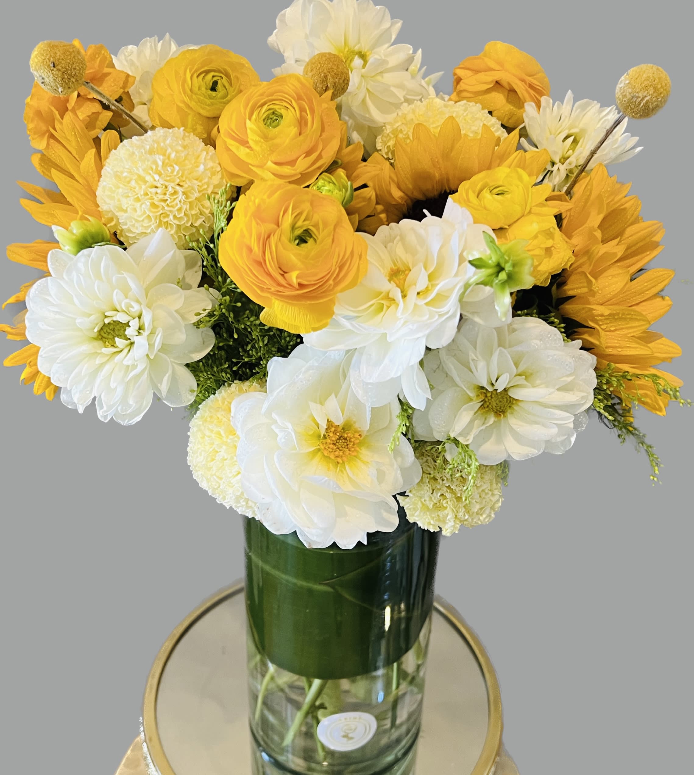 Yellow and white bouquet in a glass vase