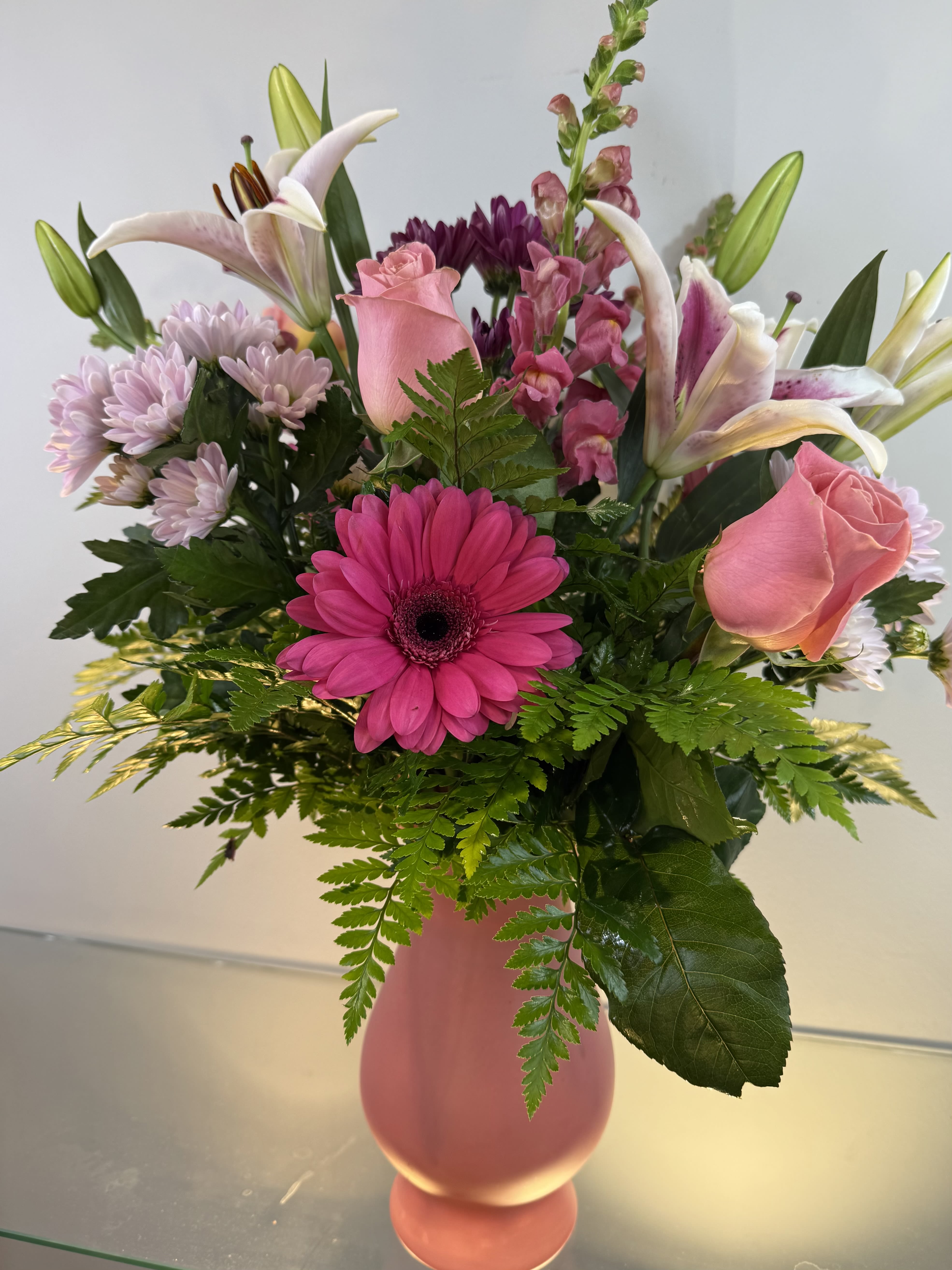 Pink and white mixed bouquet in a pink vase
