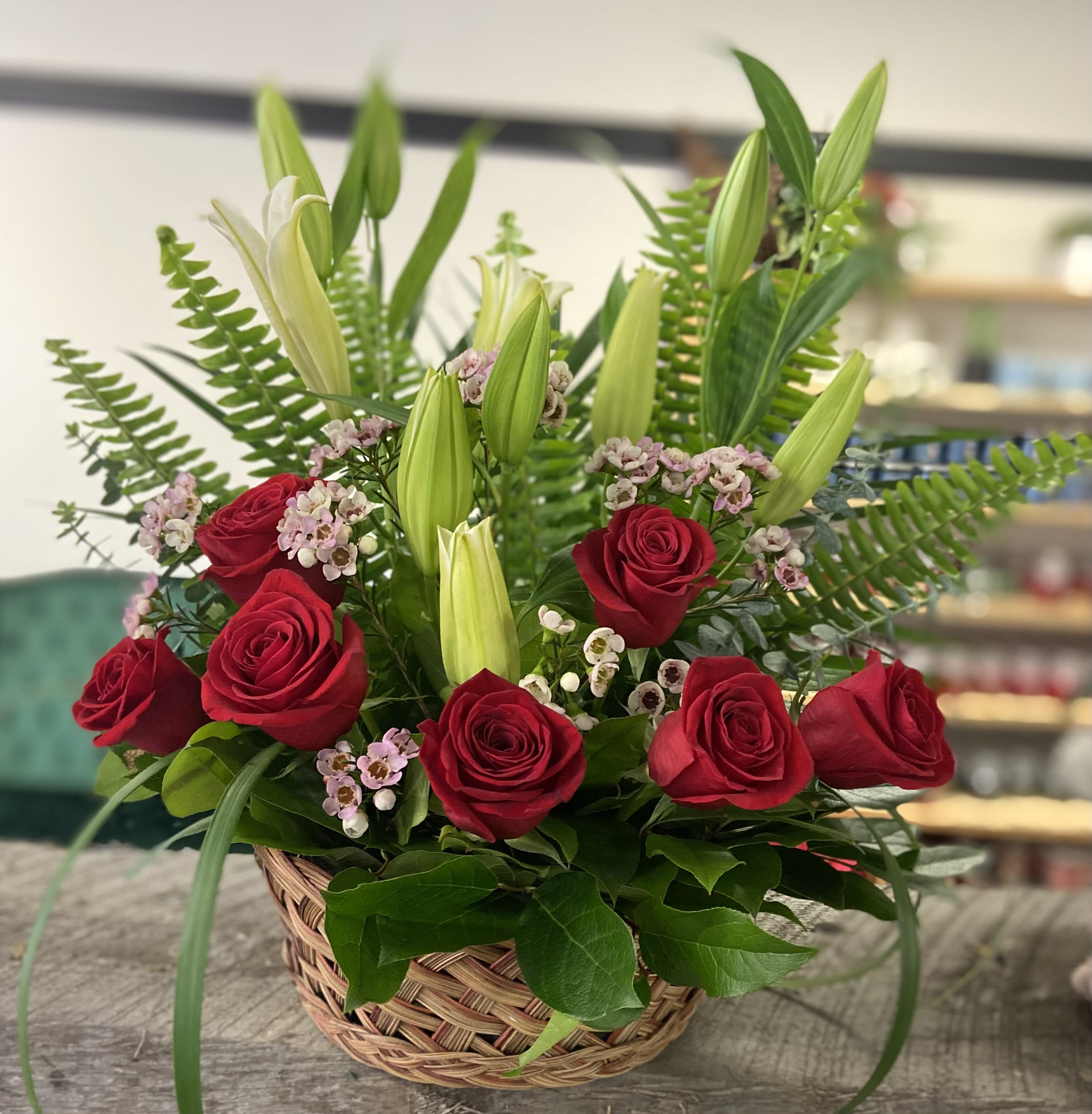 Color me Red - Bright and comforting basket. Roses and lilies are a beautiful mix.