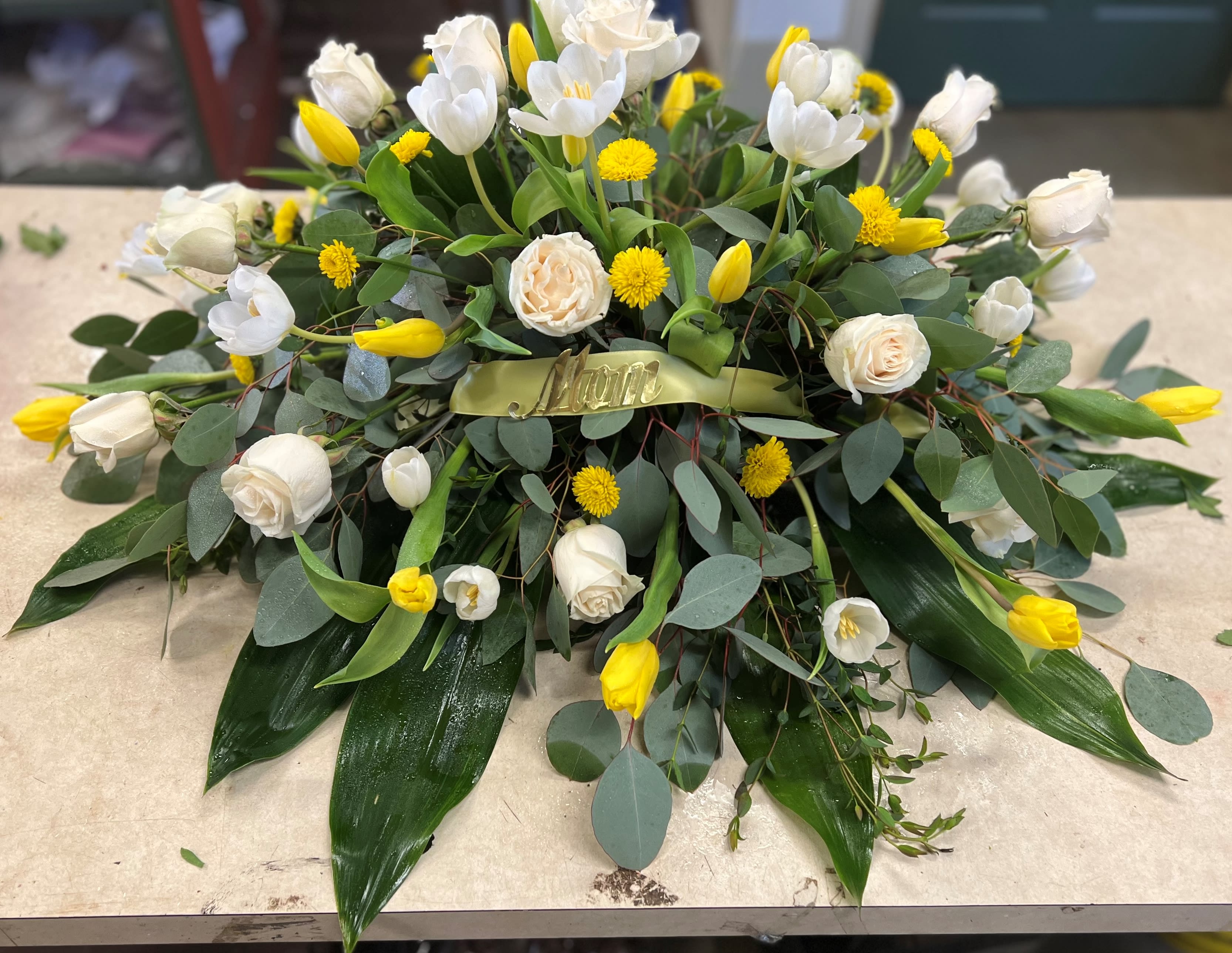 Light The Way - Casket spray with roses and tulips