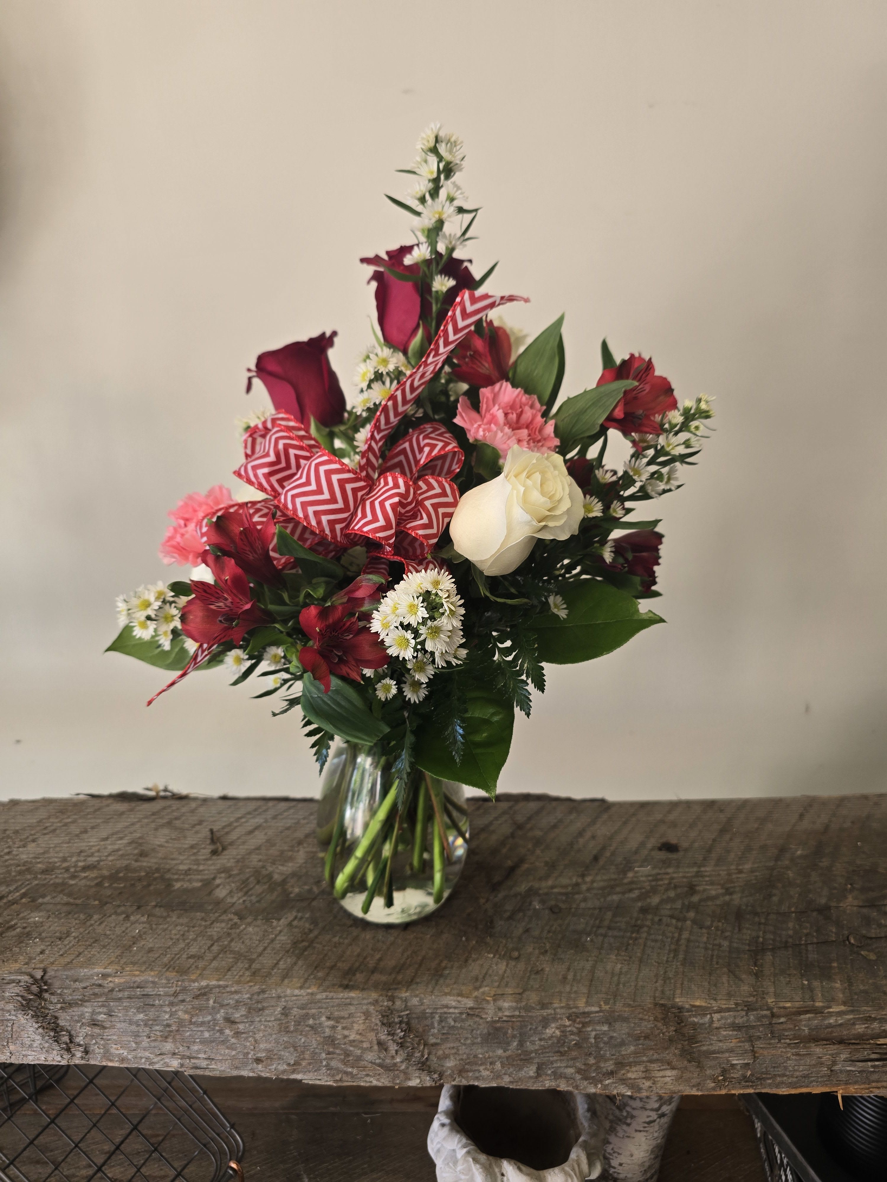 My Crush - My Crush is a beautiful arrangement in a Jordan vase, with red and white roses, a hydrangea, 4 austramaria stems, 3 carnations, Monte cristo and a bow. Perfect for Valentine's, anniversary, birthdays or date night.