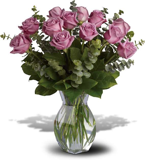 Pink roses arranged in a clear glass vase