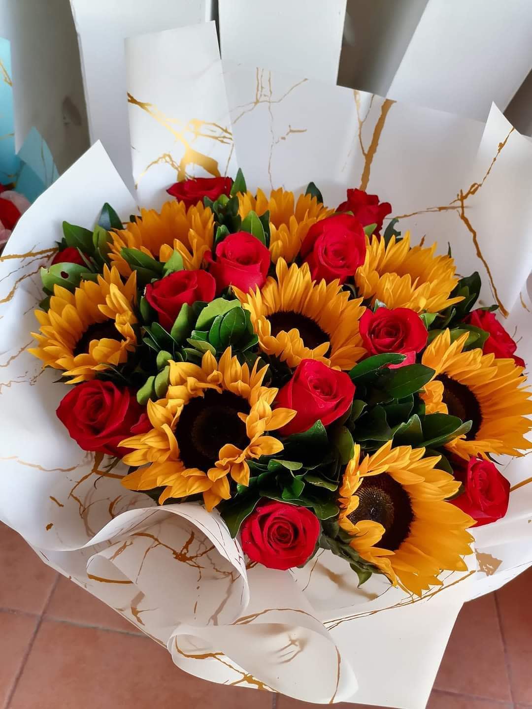 Sunroses - Make your Bright day better with thus beautiful bouquet of sunflower and red Roses 