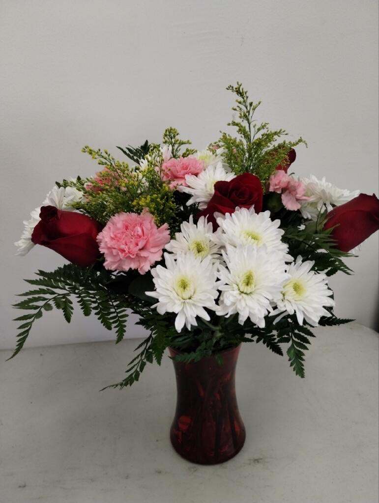 splash of love - pink carnations , red roses , greenery ,white daisies 