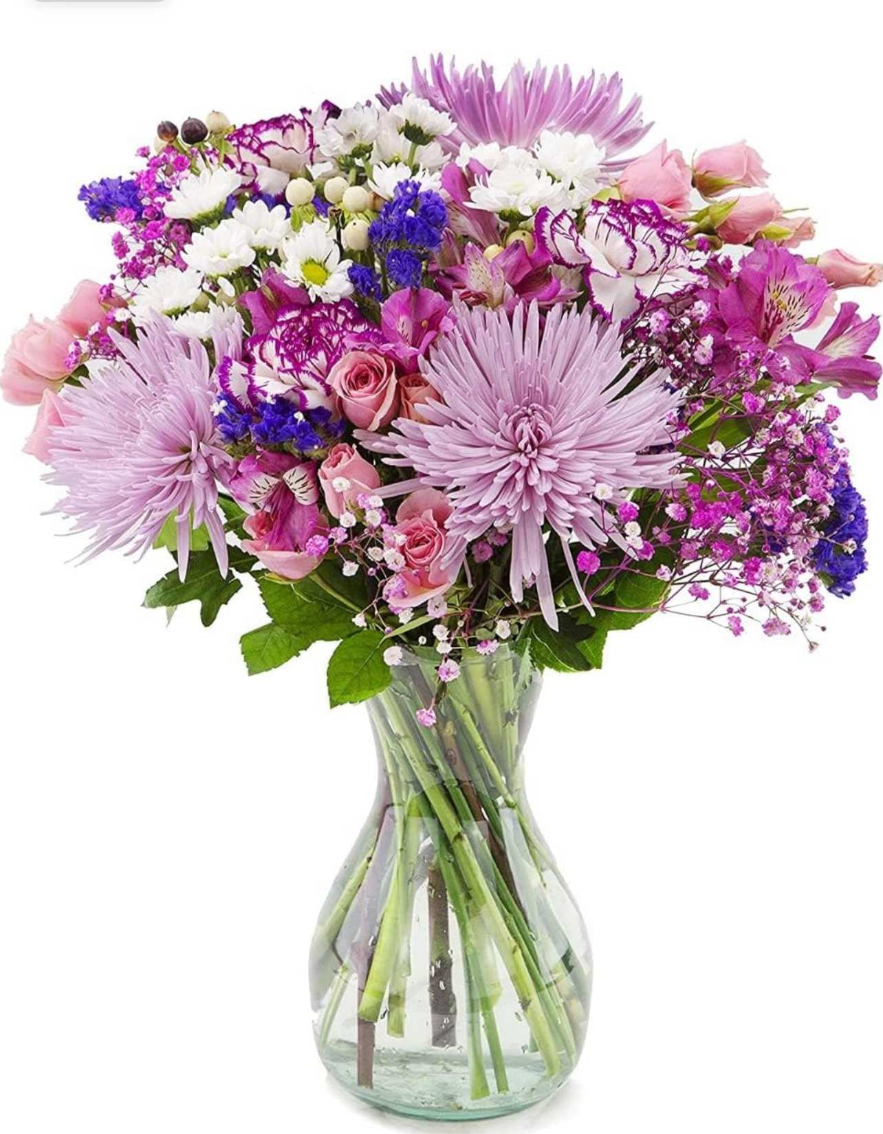 Pink and purple mixed bouquet in a clear glass vase