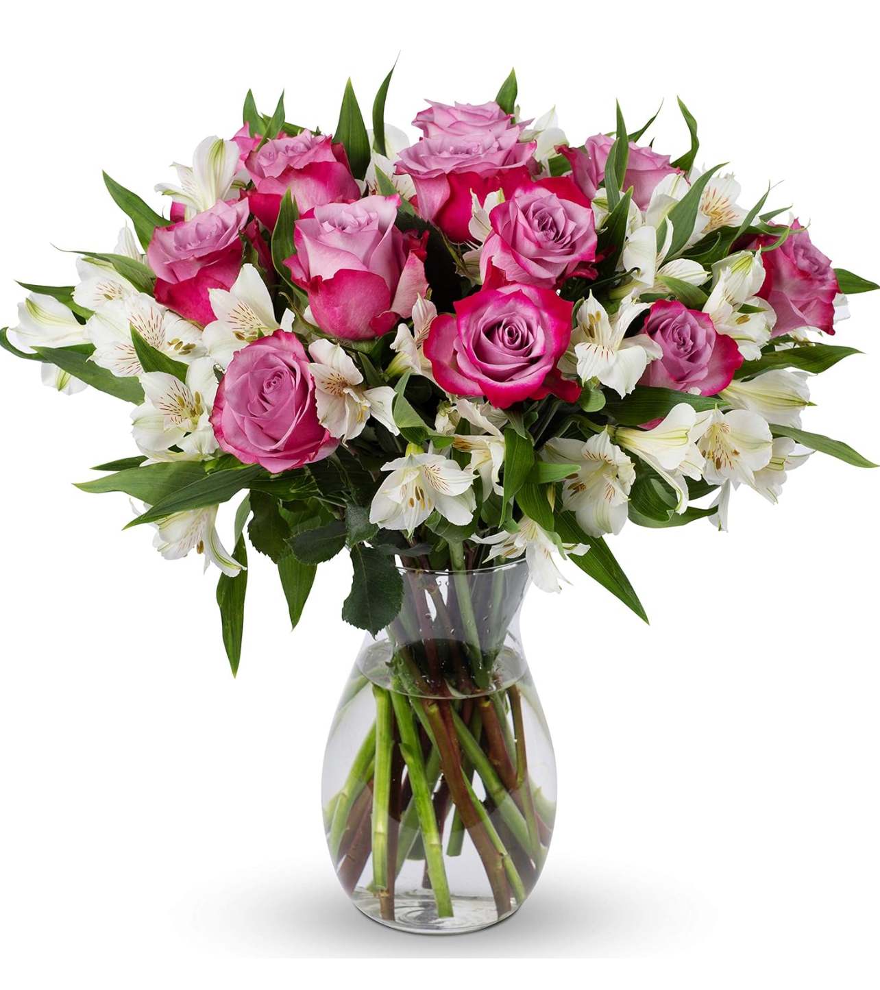 Pink roses and white alstroemeria in a clear glass vase