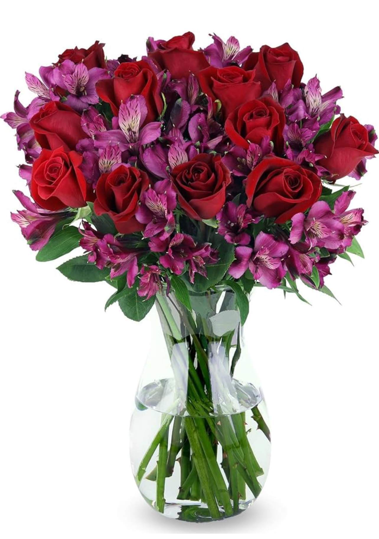 Bouquet of red roses and purple alstroemeria in a clear glass vase