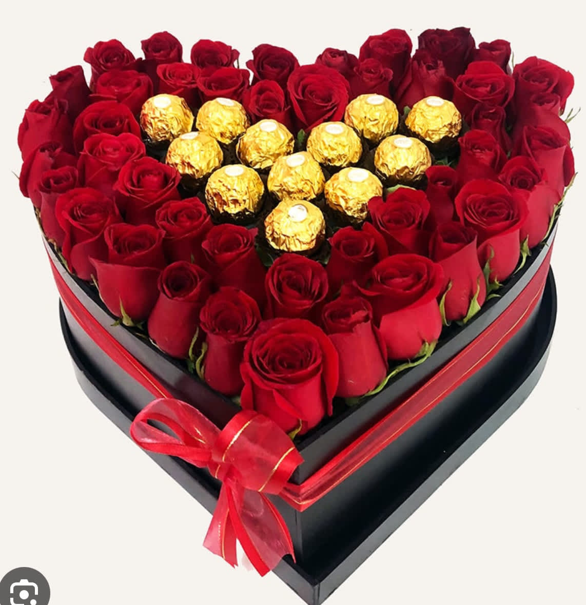 Heart-shaped box of red roses with gold-wrapped chocolates