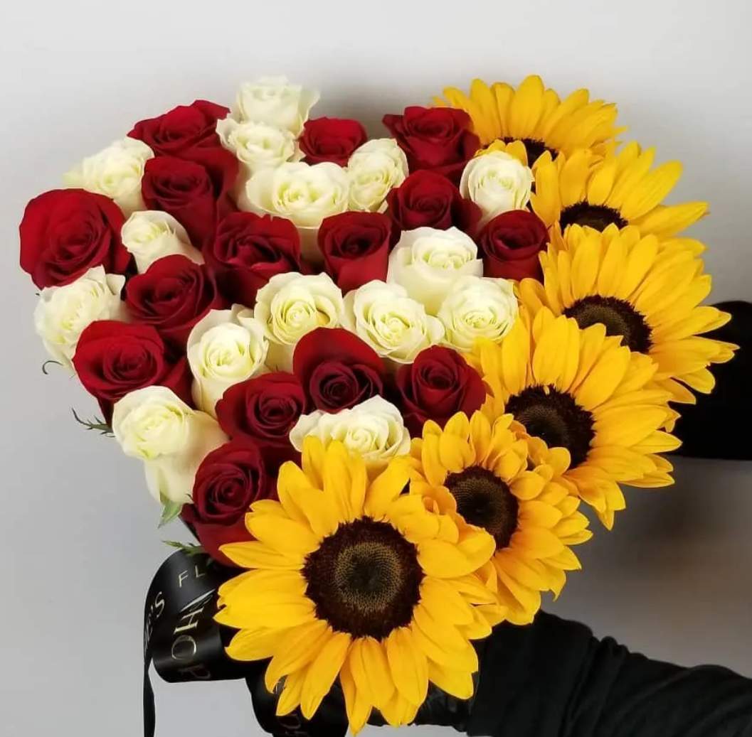 Bouquet of red and white roses with yellow sunflowers