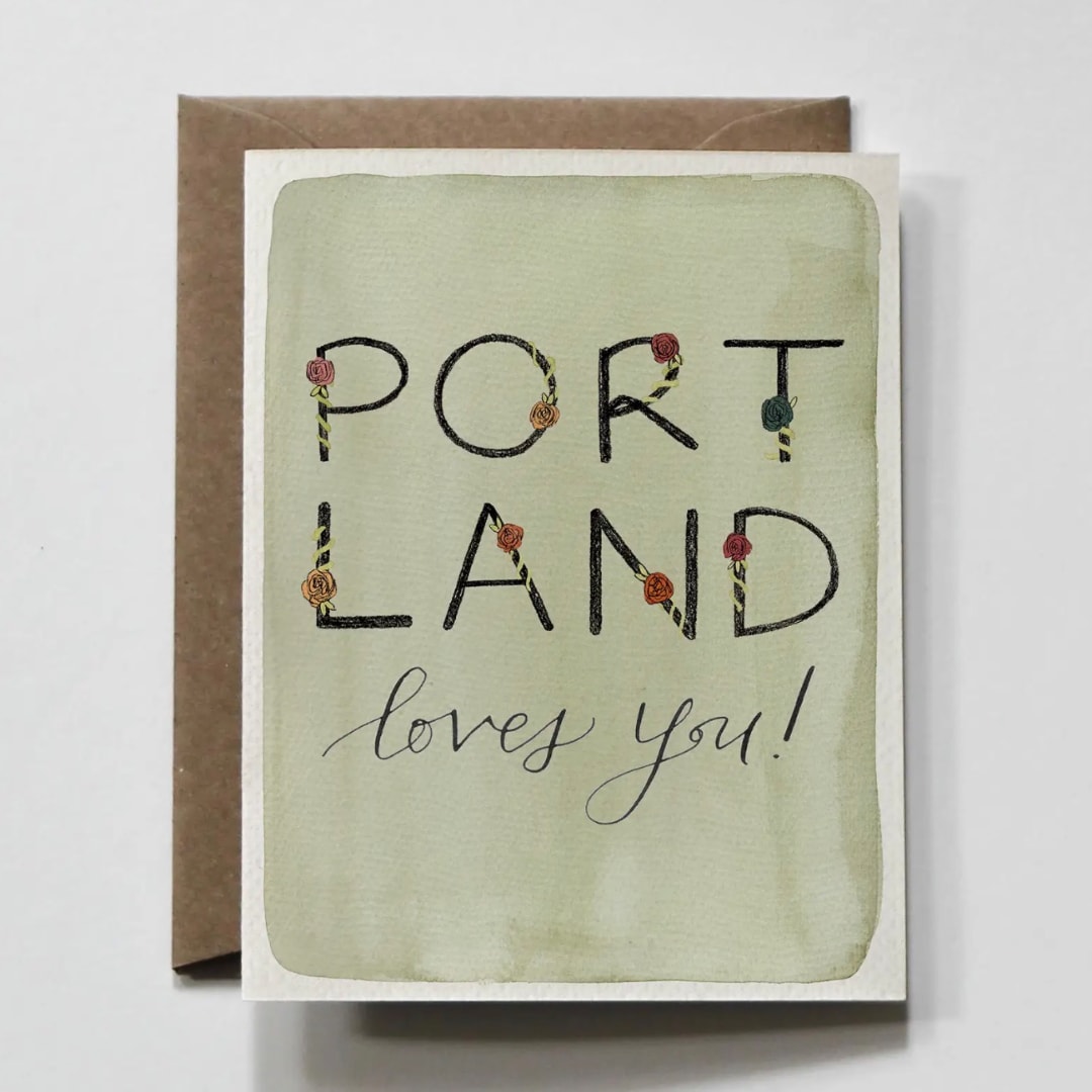 Greeting card with the words "PORTLAND loves you!" on a brown envelope