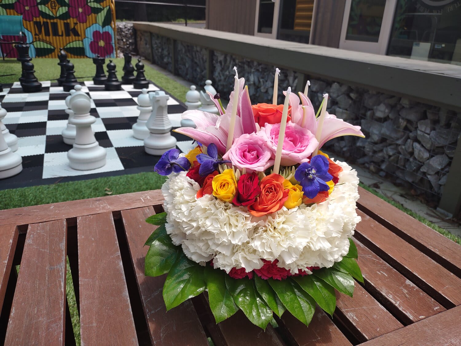 Colorful floral arrangement with roses and lilies on a table
