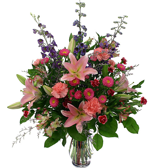 Heartfelt  Arrangement - Premium sympathy gift of pink, burgundy and blue flowers. Lilies, delphinium, daisies, carnations, miniature carnations and limonium are elegantly arranged. This beautiful sympathy gift is a lovely way to show them that you are thinking of them.