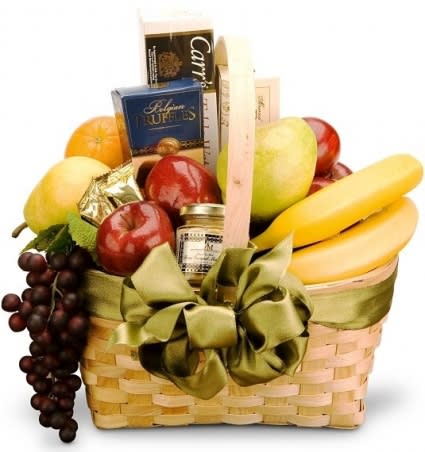 SOPHISTICATED TASTES BASKET - A gift of distinction filled with the most delicious assortment of foods for any occasion.An elegant handled basket holds the freshest fruits, such as oranges, apples, kiwi, pears, bananas, and grapes. The fruits are complemented by savory snacks such as gourmet mustard, cheeses, and crackers. For a crowning touch, we add a selection of candies or chocolates.
