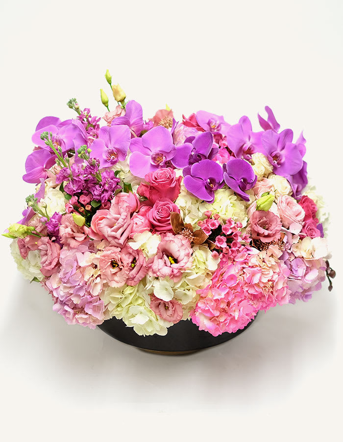 Sweetest Love Arrangement - This selection of flowers is a thoughtful and caring way to show someone how wonderful you think they are , fresh and colourful purple,orchid &amp; Pink Hydrangeasand cream coloured flowers arranged ,eryngium symbolising love and attraction. Together with lisianthus and eucalyptus, these flowers are a darling gift.