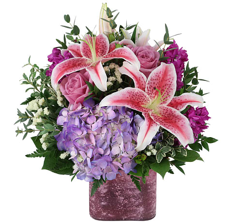 Floral Dreams Bouquet - Give them the floral arrangement of their dreams with this special  Flower Bouquet original! Bright purples, pinks, and whites will be sure to bring a smile to her face!