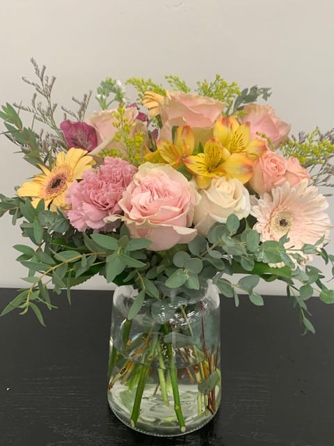 Mixed pastel bouquet in a clear glass vase