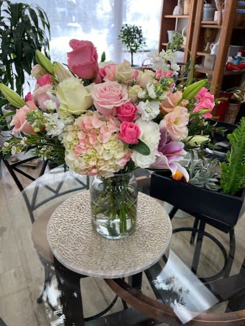 Pink and white mixed bouquet in a clear glass vase