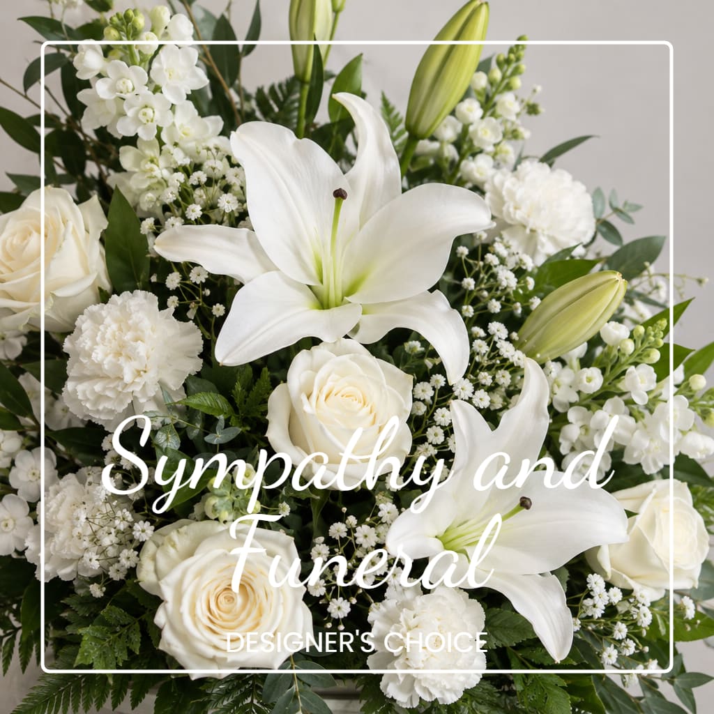 White lilies and roses arranged with white filler flowers