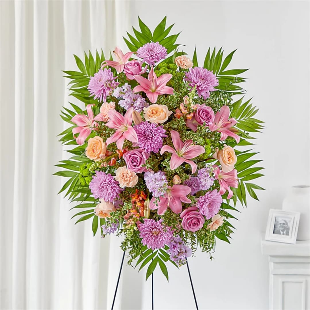 Pink and peach floral standing spray on an easel