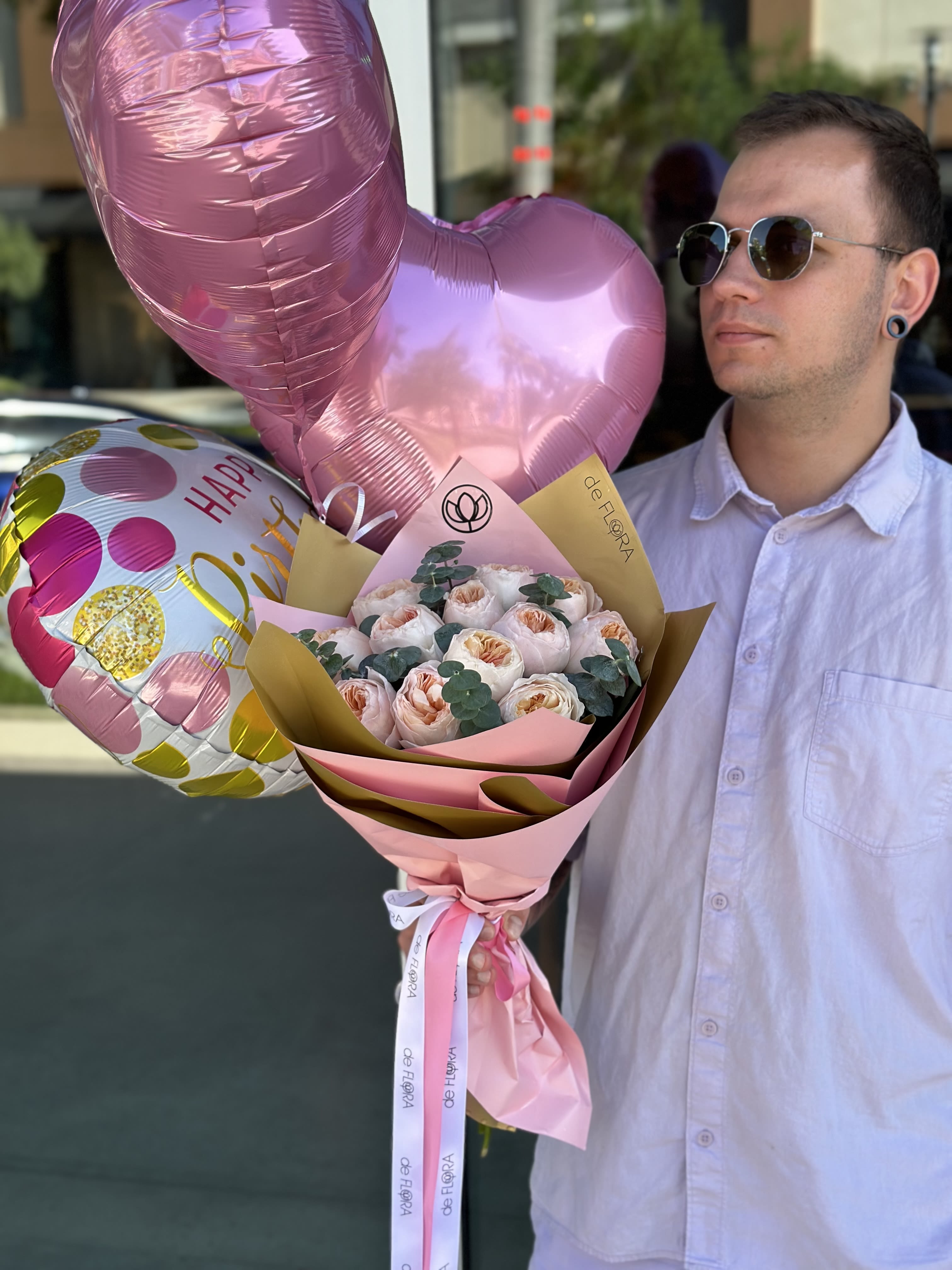 Pink rose bouquet with heart-shaped balloons