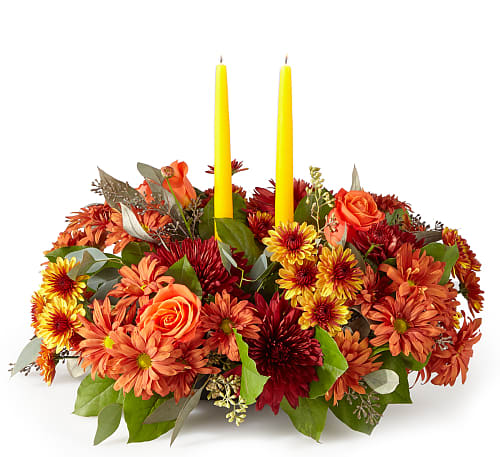 Ember Centerpiece - Cast your holiday meals in a whole new light with this lovely centerpiece, which draws from the season’s most stunning bronze, red and orange florals and foliage