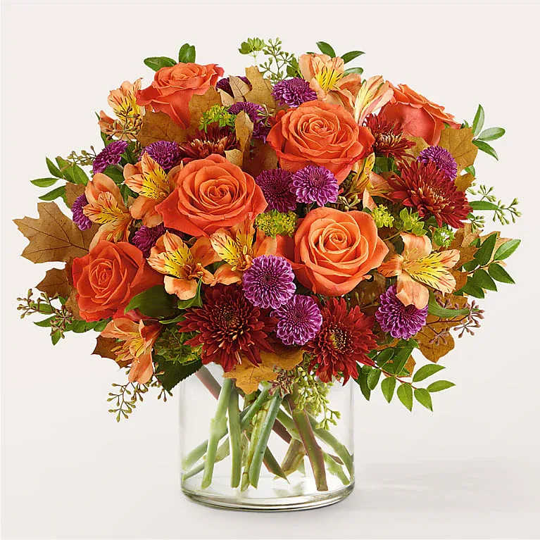 Orange You Glad Bouquet - Crack a smile with the Orange You Glad Bouquet, a harmonious balance of orange and purple florals.
