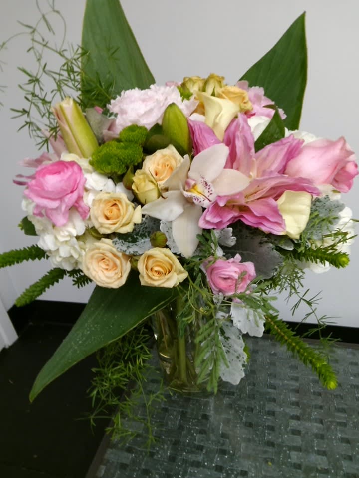 Pink and cream mixed bouquet in a glass vase