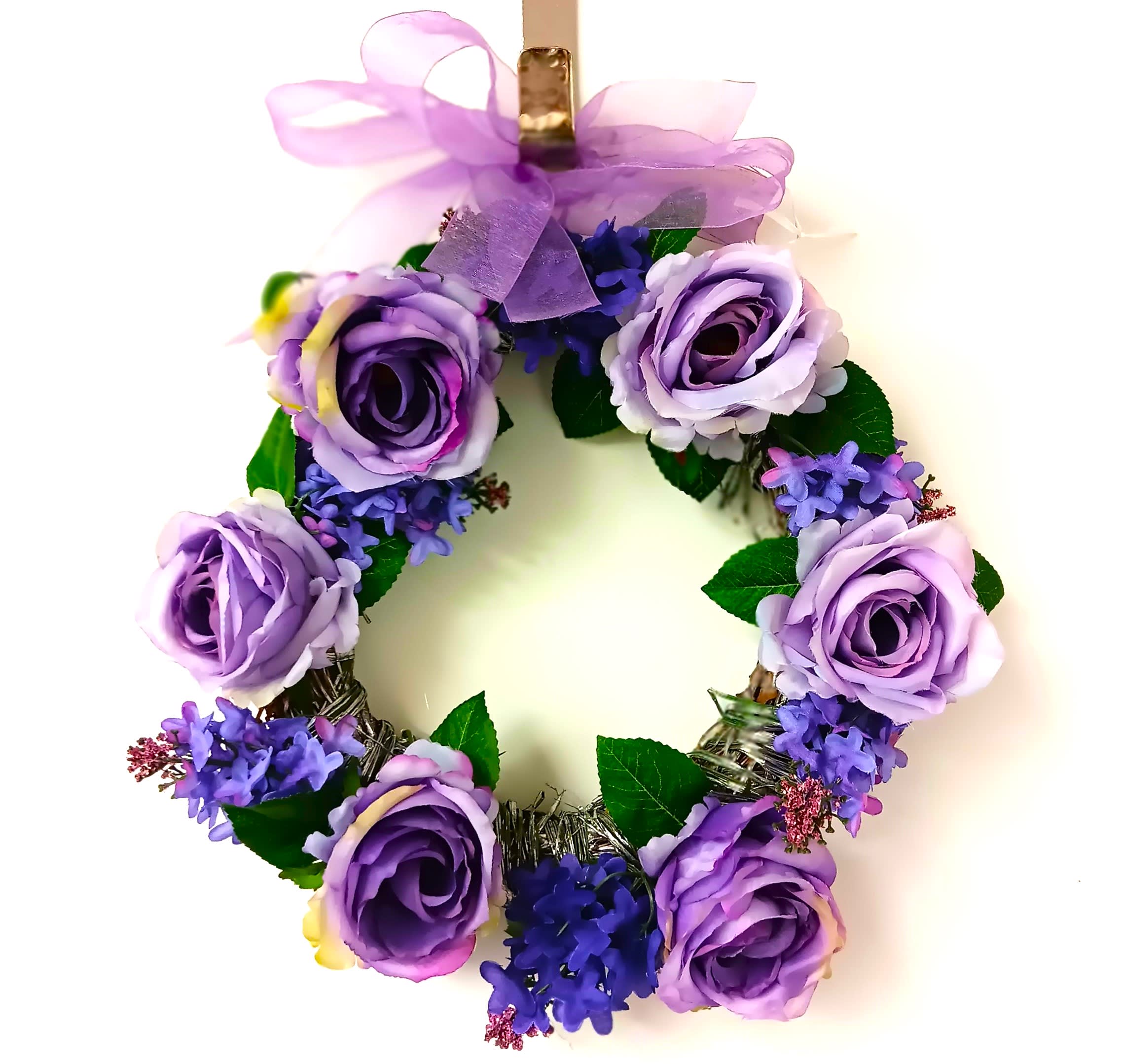 Purple floral wreath with roses and ribbon bow