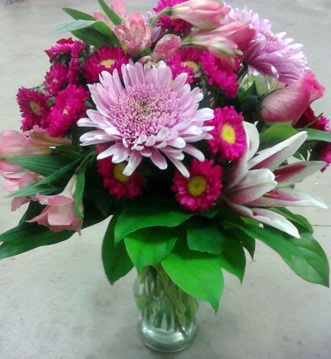 Pink and white mixed bouquet in a clear glass vase
