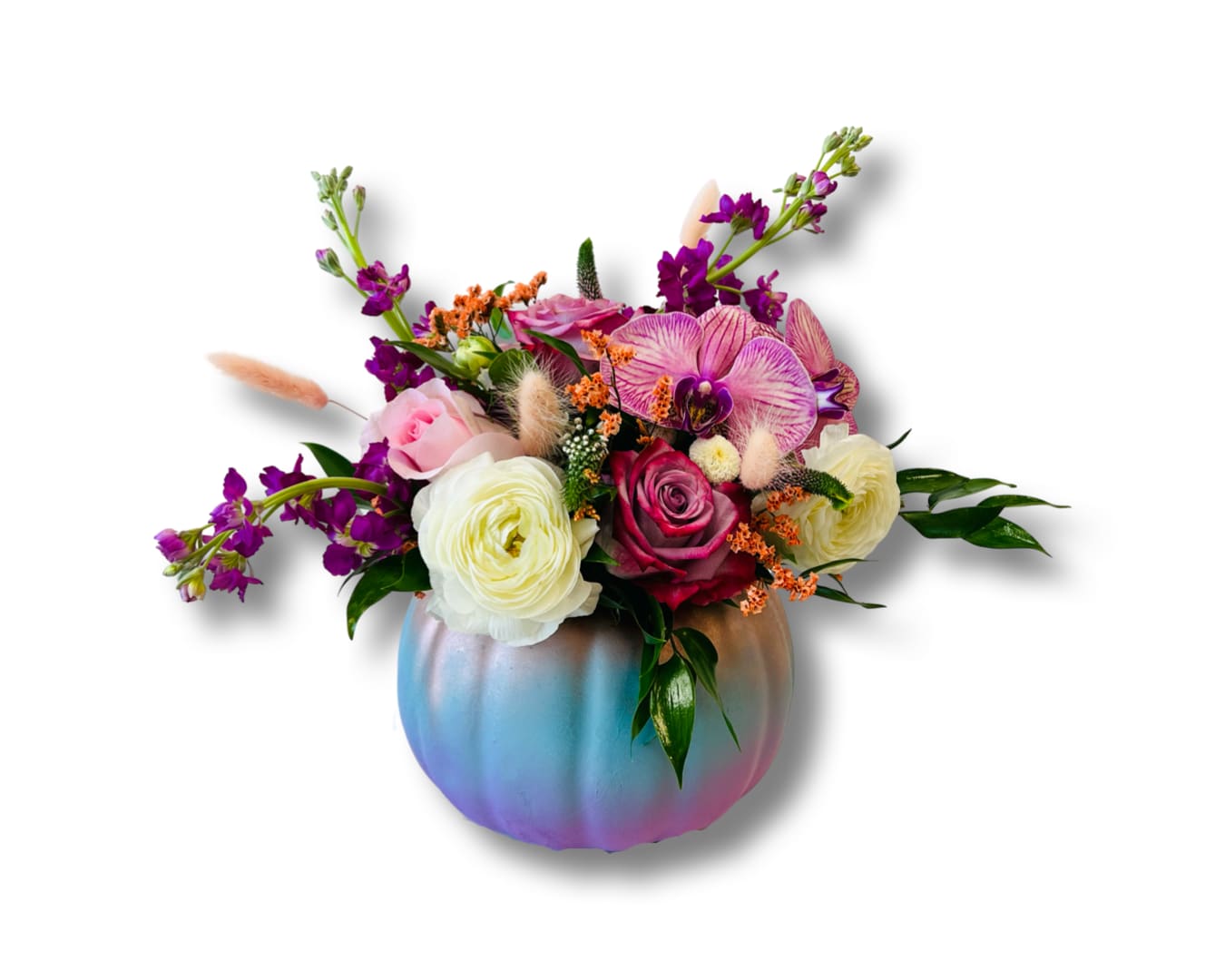 Mixed bouquet in an iridescent pumpkin vase with pink, white, and purple blooms