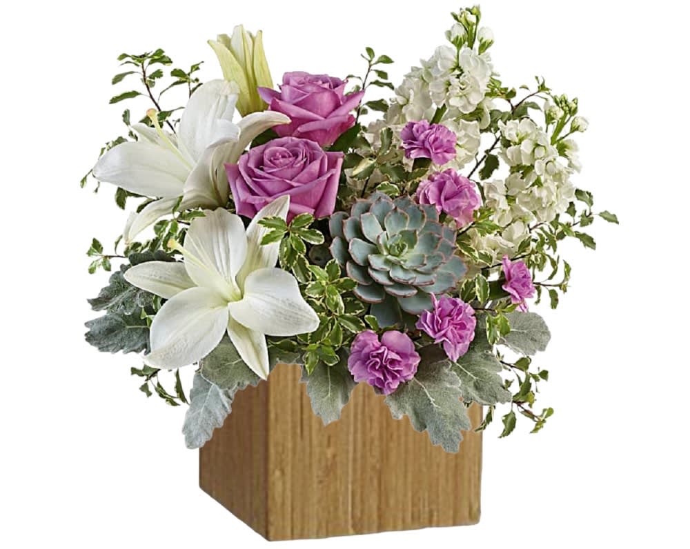 Pink roses and white lilies arranged in a wooden cube vase