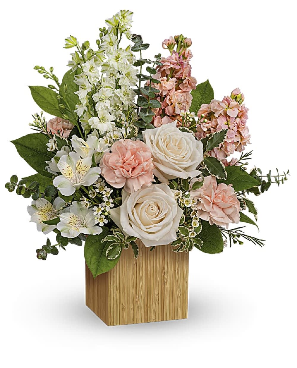 Pink and white floral arrangement in a wooden cube vase