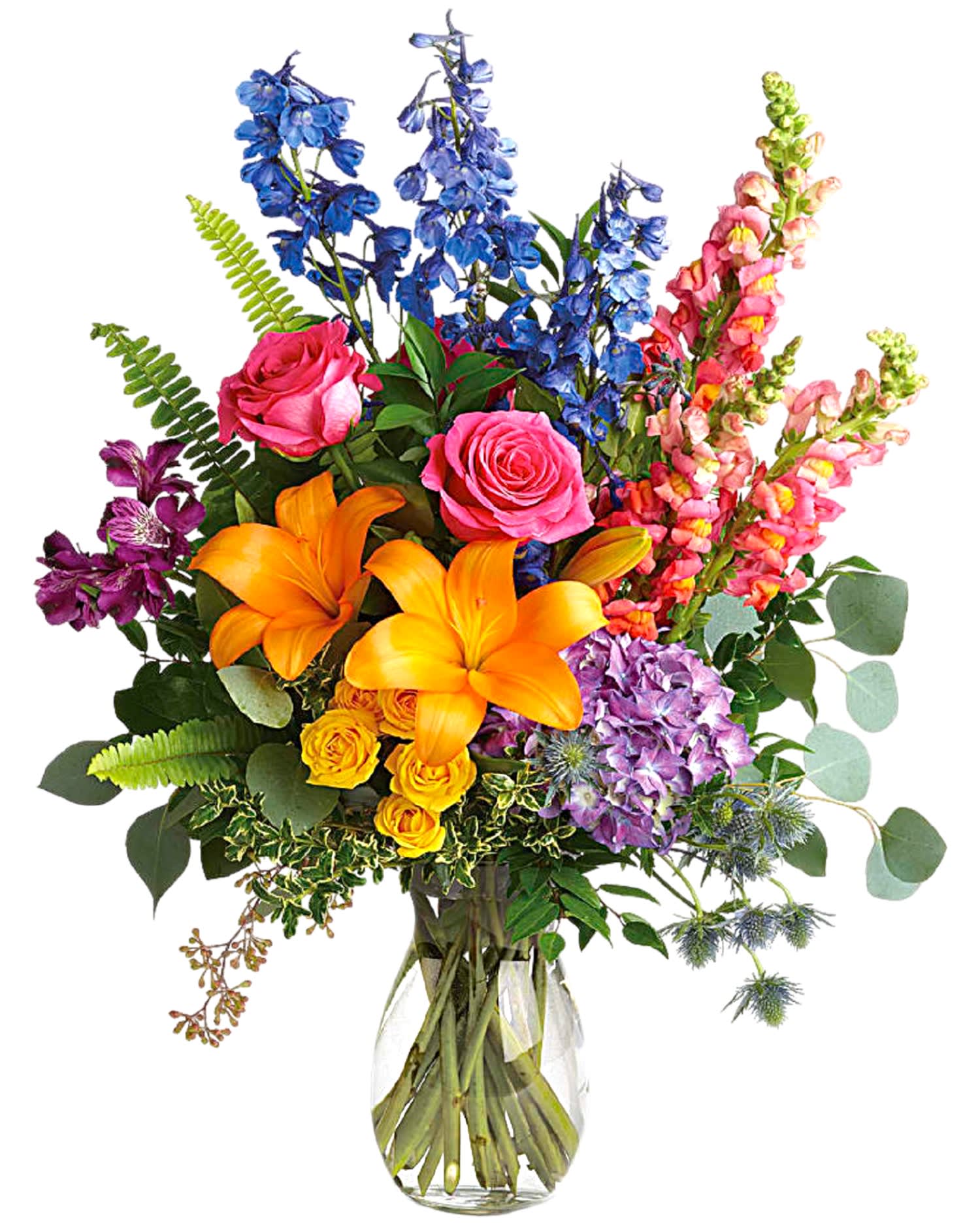 Colorful bouquet of roses, lilies, and snapdragons in a glass vase