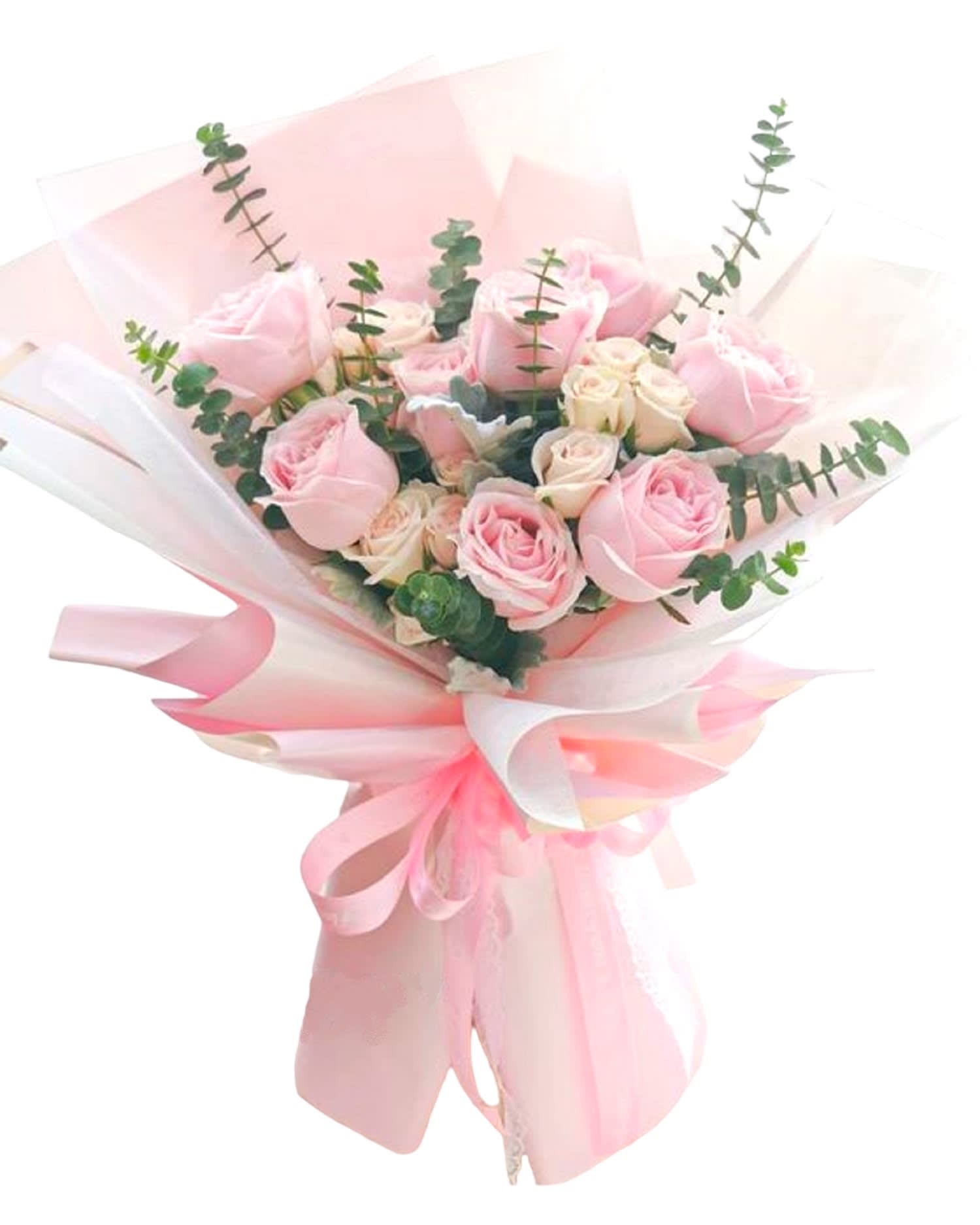 Pink and cream rose bouquet wrapped in pale pink paper