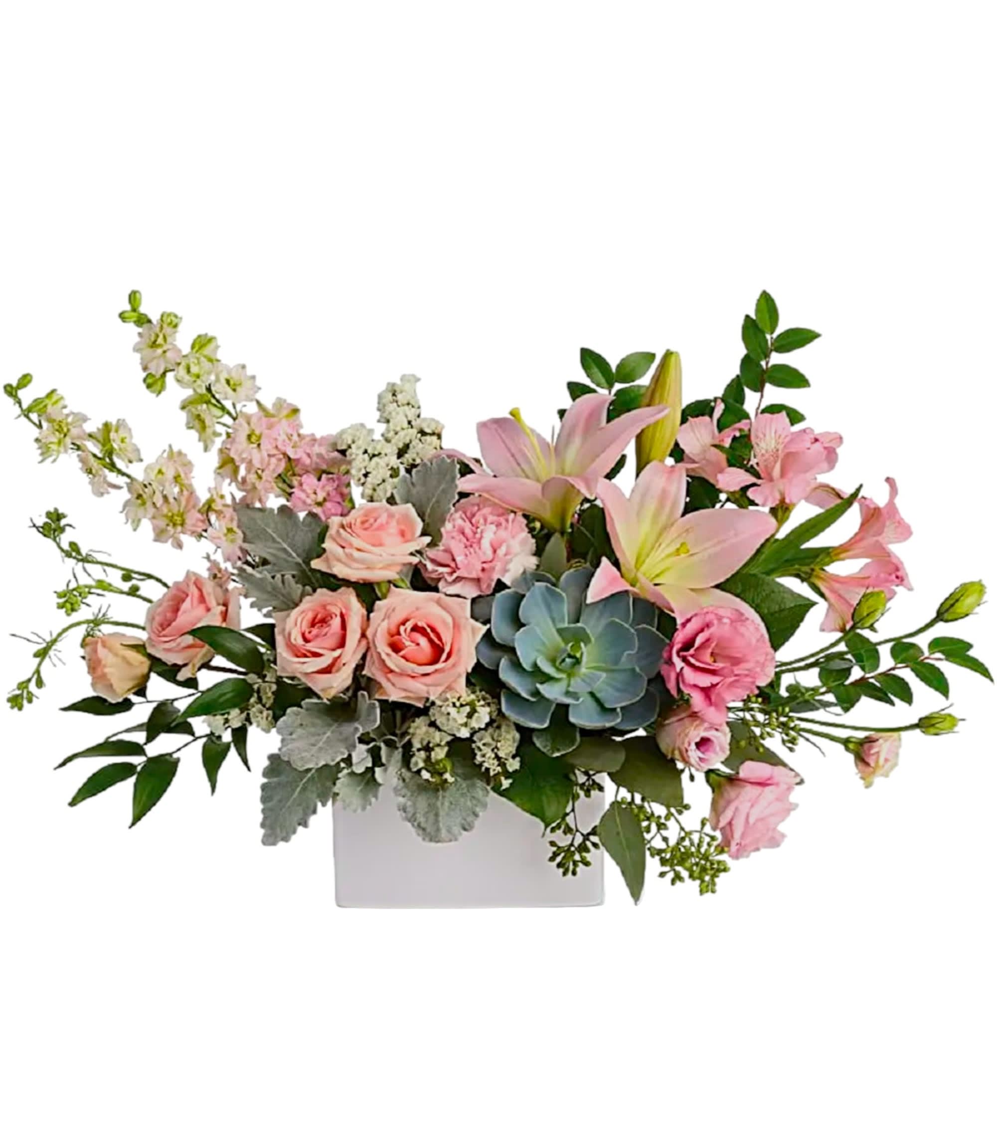 Pink roses and lilies arranged in a white rectangular vase