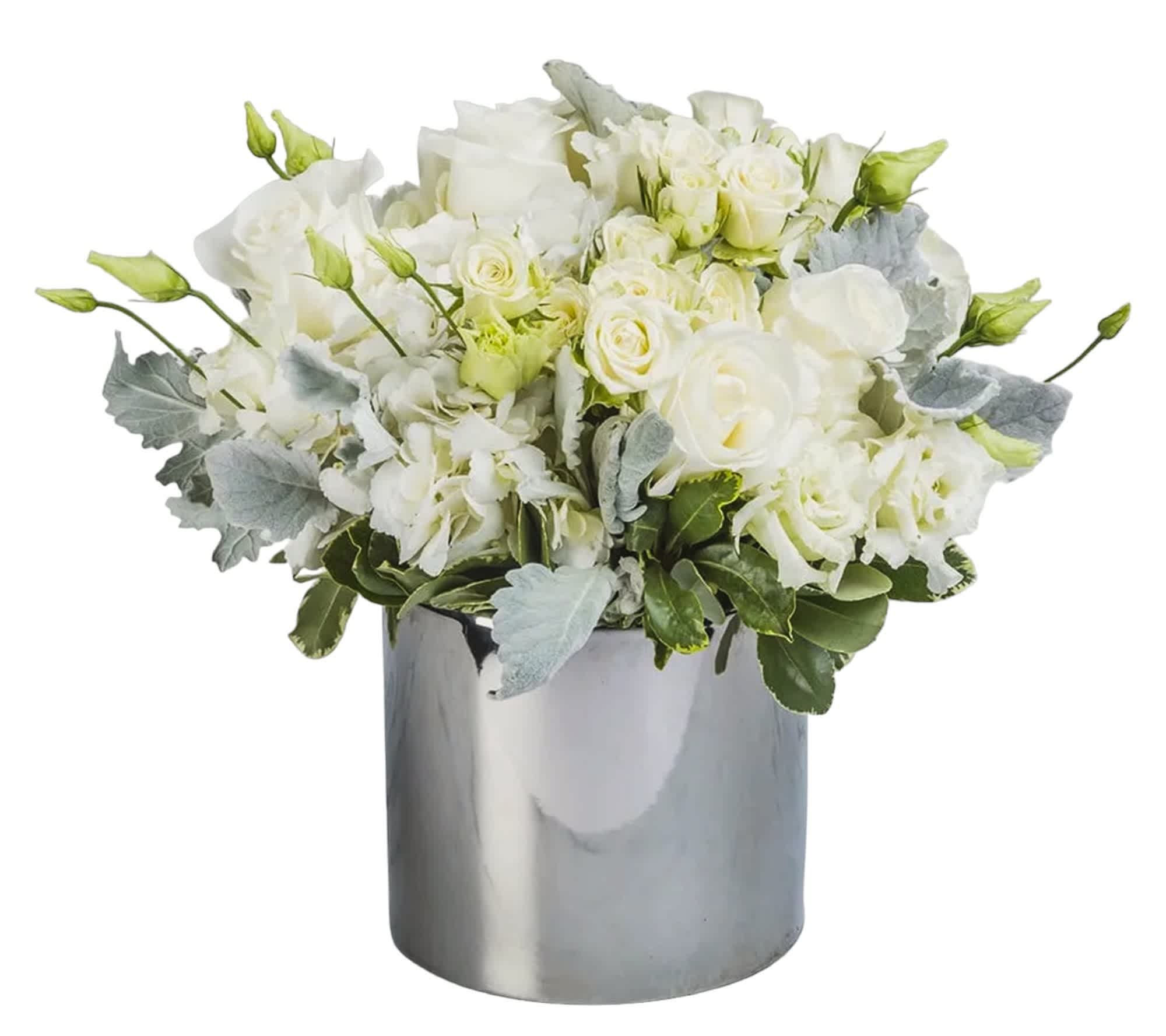 Dressed to Impress By BloomNation™ - Do you know someone who’s hard to impress? Of course, you do. This arrangement was engineered specifically for that person. Knock them off their feet (not literally - flowers are instruments of peace) with this magnificent piece of floral artistry.   DETAILS A stylish painted glass cube vase features lovely flowers including roses, spray-roses, hydrangeas, and lisianthus. Variegated pittosporum and dusty miller add a touch of green.  VASE INCLUDED Orientation: All-Around Item #NF-234  FLORIST-TO-DOOR Same day flower delivery on most orders placed online by 12 pm or 10 am on weekends PST.  BLOOM DETAILS Roses Spray Roses Hydrangeas Lisianthus Greenery  The Standard Arrangement (SHOWN) The Deluxe Arrangement The Premium Arrangement   How to place an order? 1. You can place an order directly on this secure website OR 2. You can call in your order by dialing: (323) 262 - 9238 OR 3. You can visit our store (appointment recommended 323.262.9238)  NINFA'S FLOWERS 2405 WHITTIER BLVD. LOS ANGELES, CA. 90023  ATTENTION: *Please note that on busy holidays, Valentine's Day, and Mother's Day, we cannot verify if the recipient received the flowers until the following day. You can verify delivery on the website after 10:00 pm, call 323.262.9238 the following day after 10:00 am, or contact the recipient directly. Thank you for your patience and understanding.
