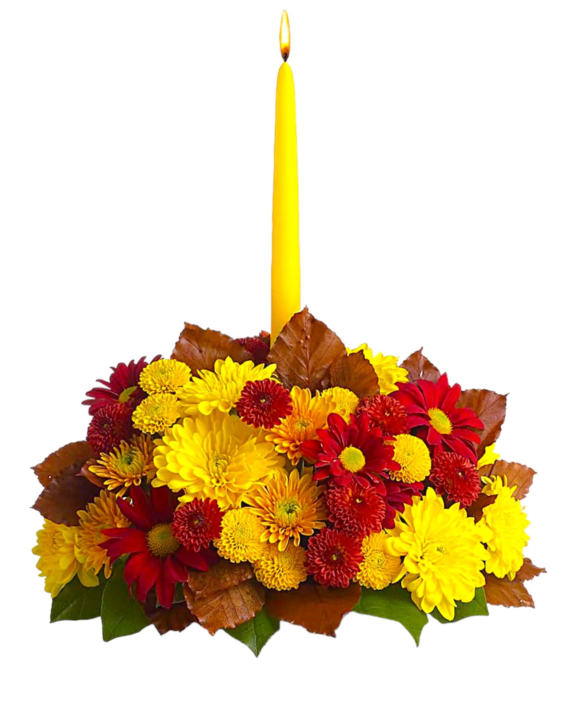 Yellow candle in a low arrangement of red and yellow chrysanthemums