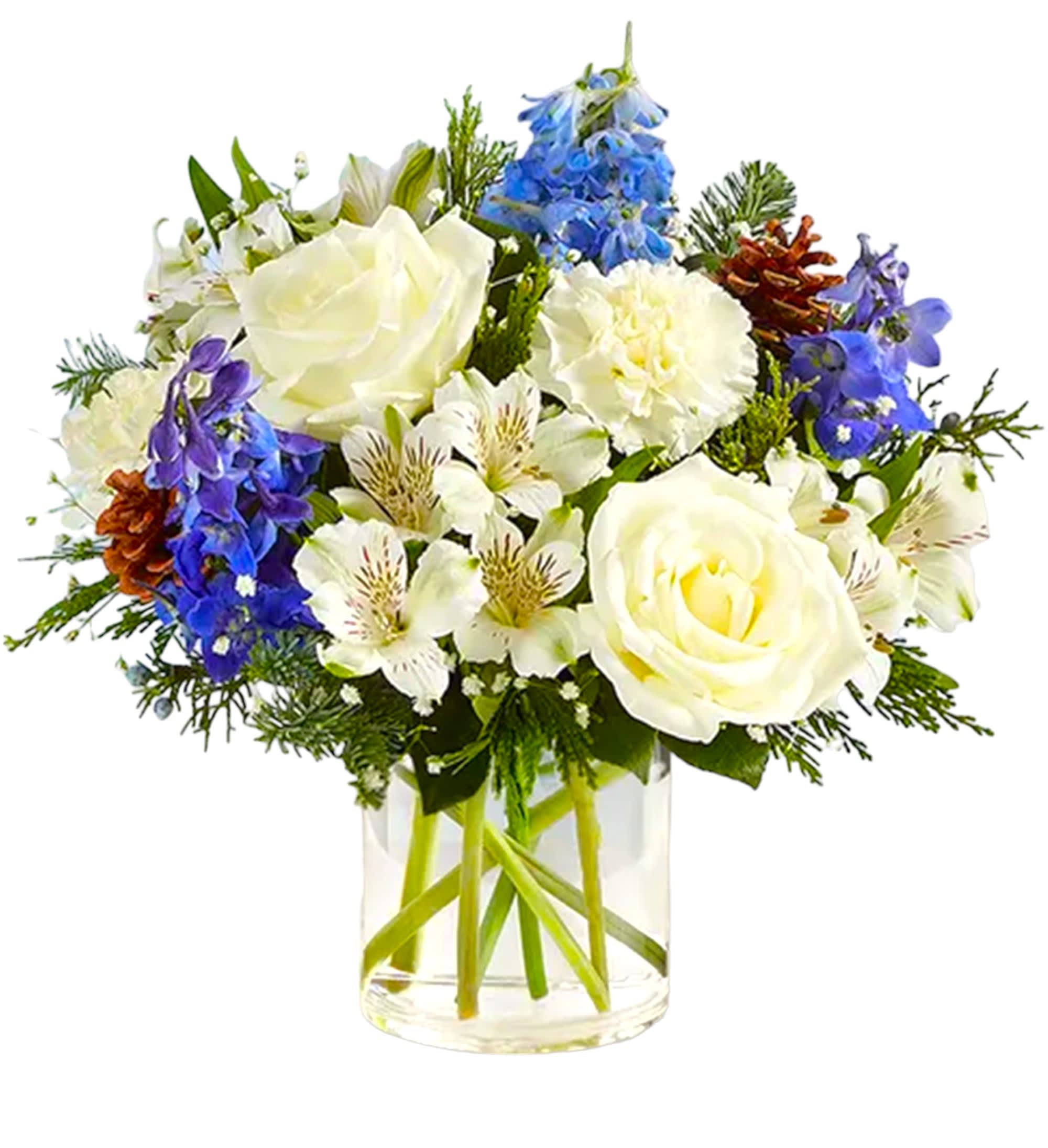 White roses and blue flowers arranged in a clear glass vase