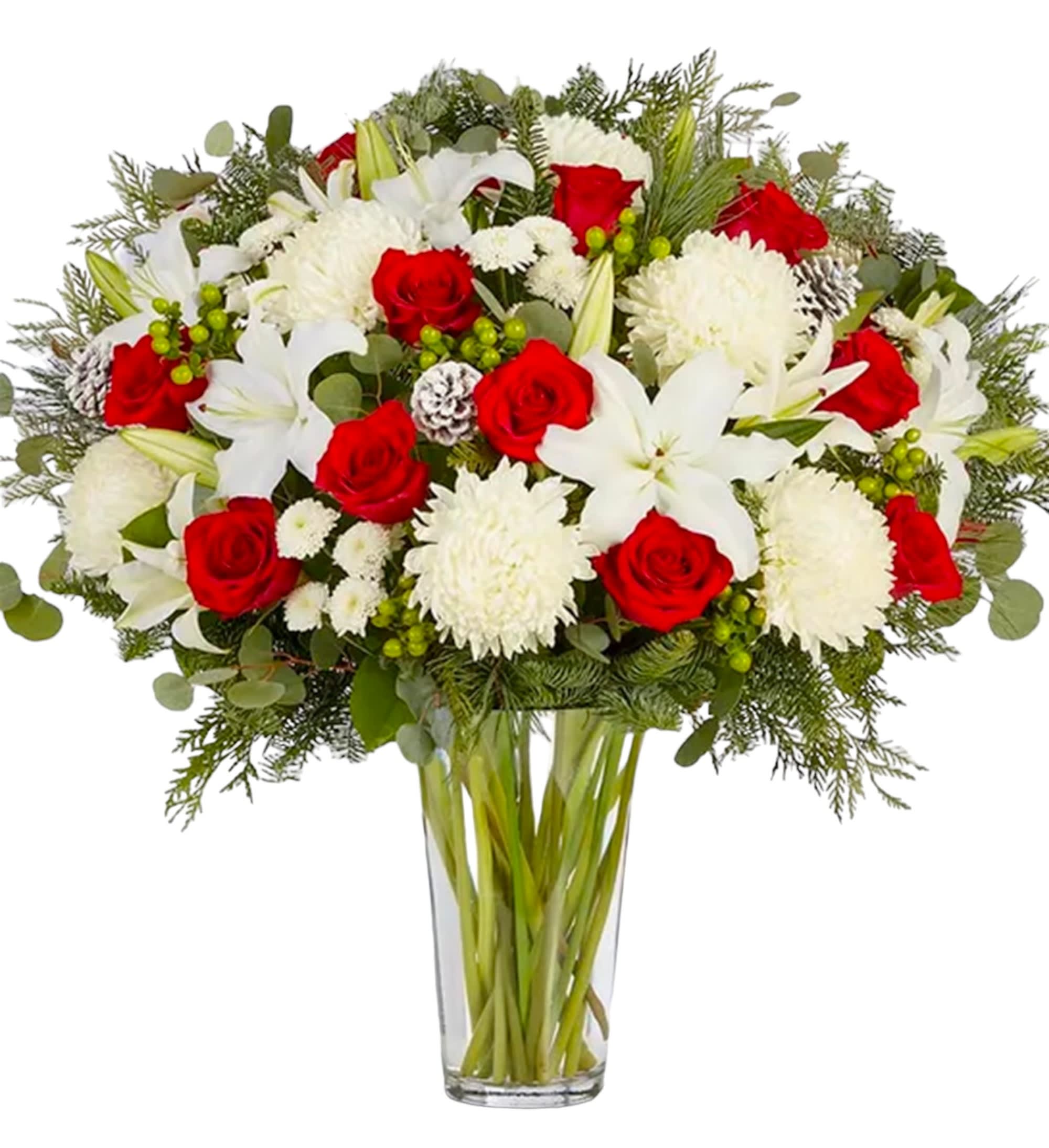 Red roses and white lilies in a clear glass vase