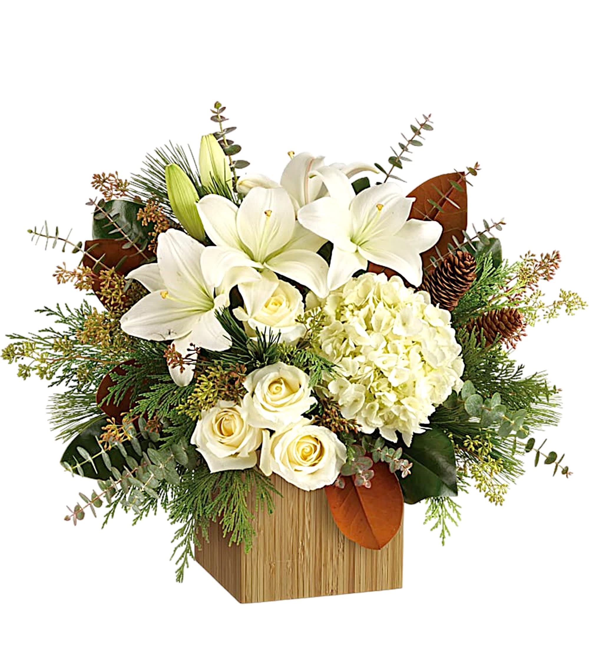 White lilies and roses arranged in a wooden box with greenery