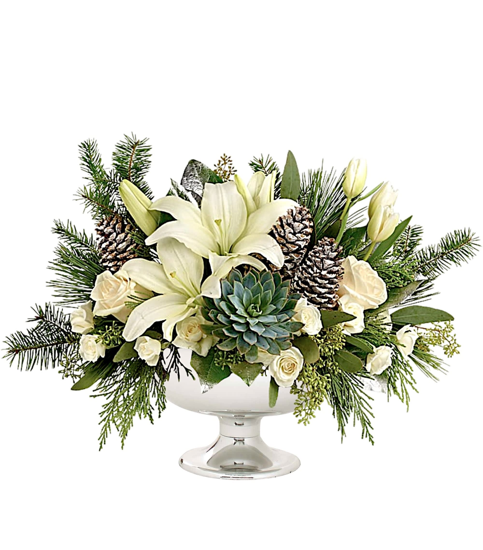 White lilies and roses in a glass pedestal bowl with pinecones