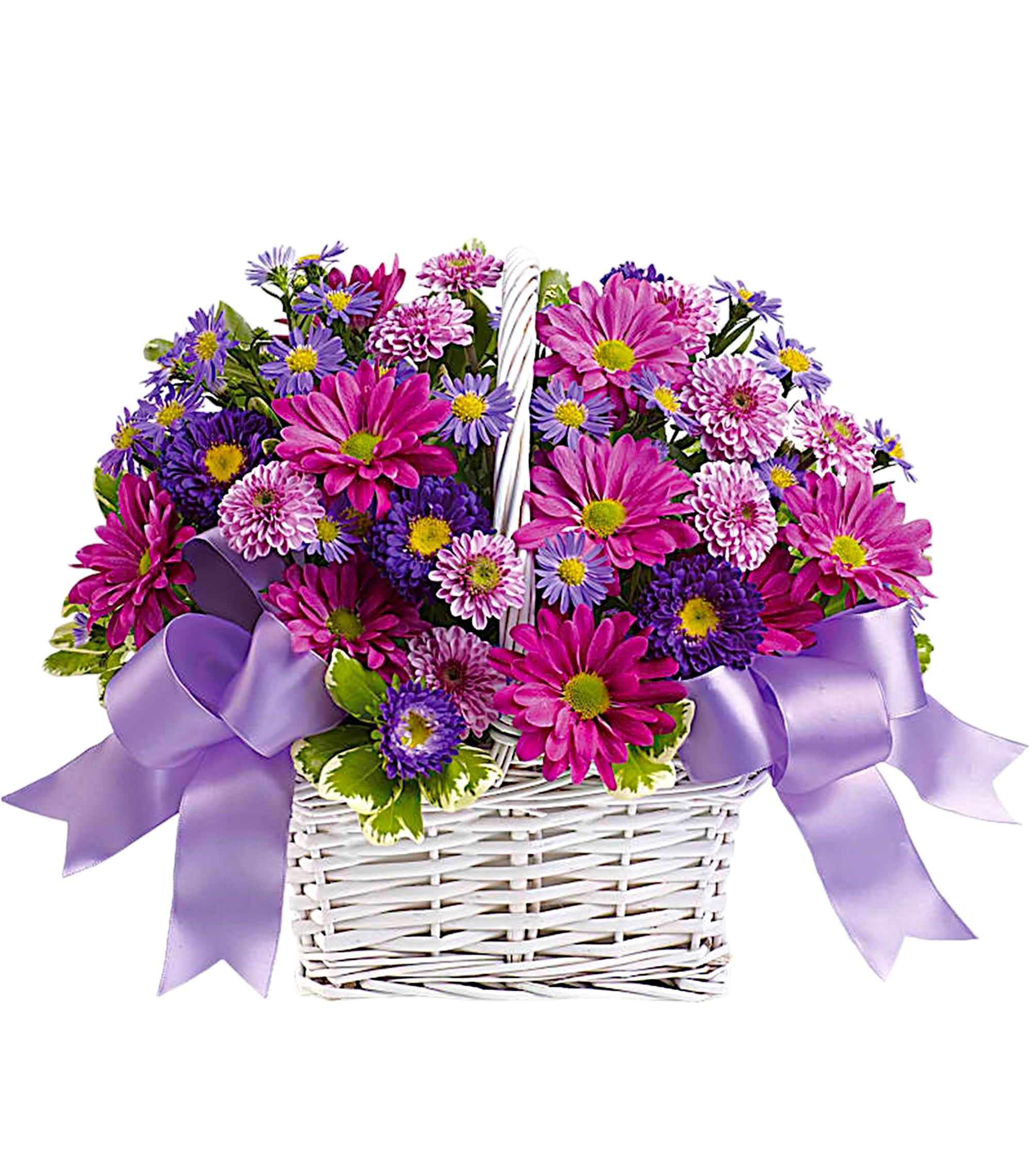 Pink and purple flowers in a white wicker basket with lavender ribbons