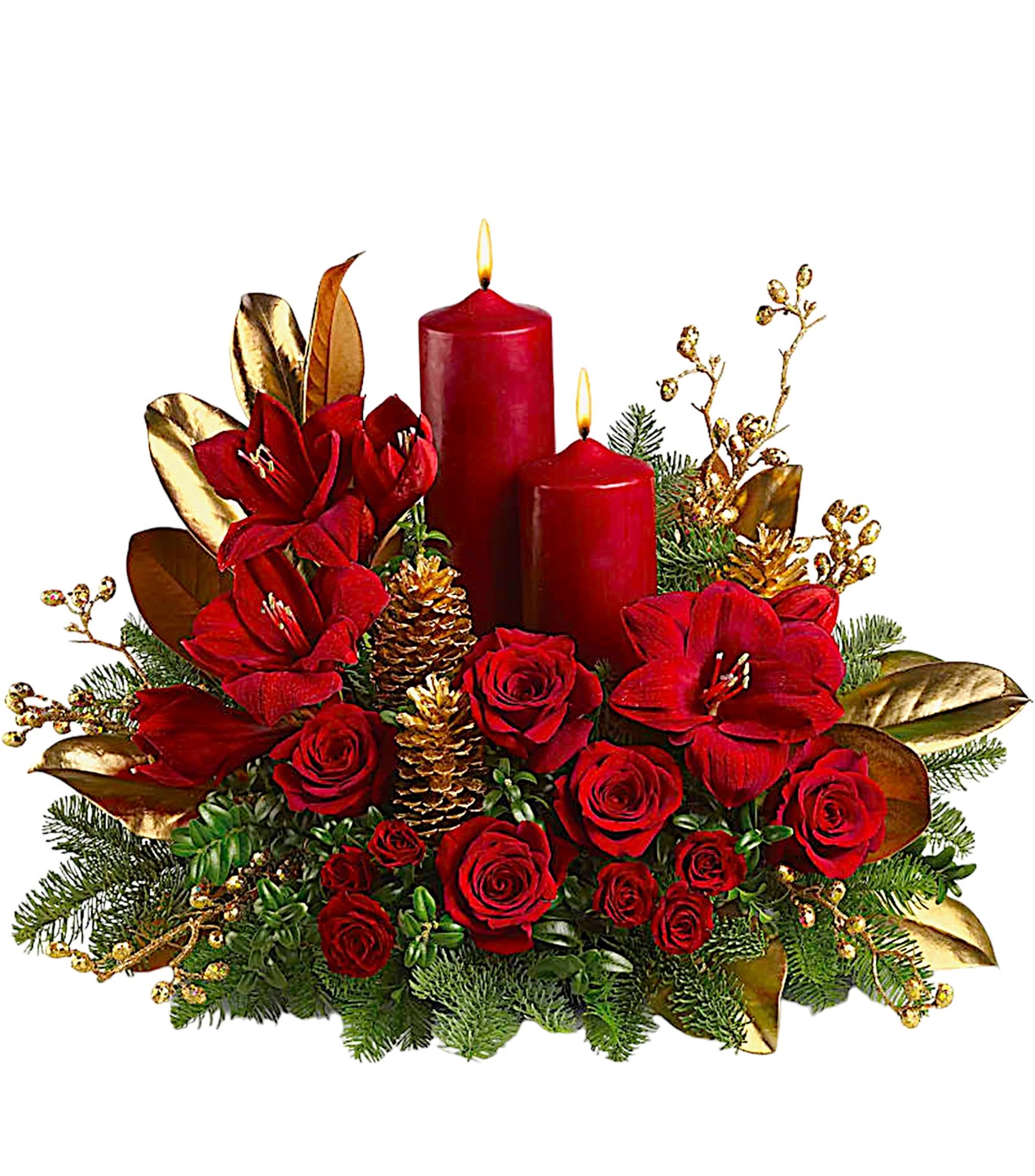 Red roses and amaryllis with two lit red candles in a holiday centerpiece