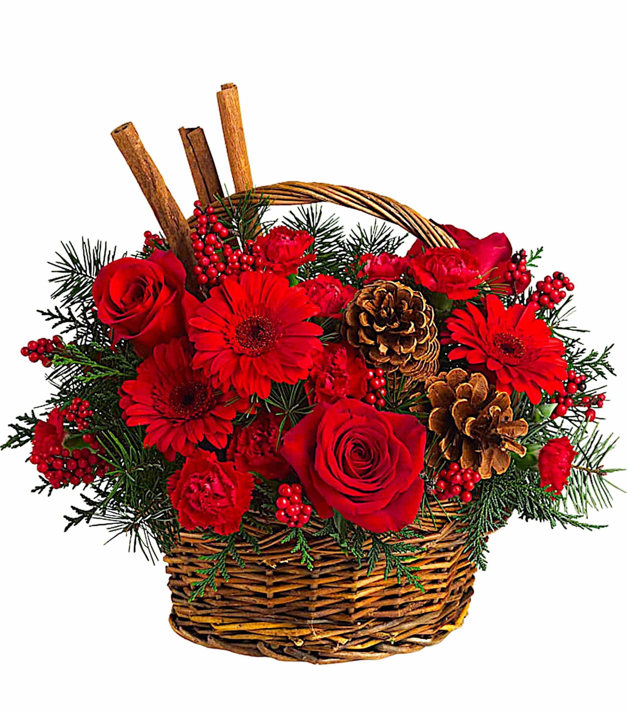 Red roses and gerbera daisies in a wicker basket with pinecones