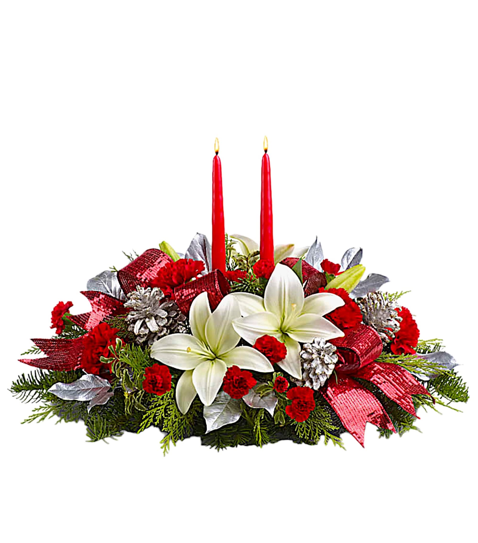 Holiday centerpiece with white lilies, red carnations, and two red candles