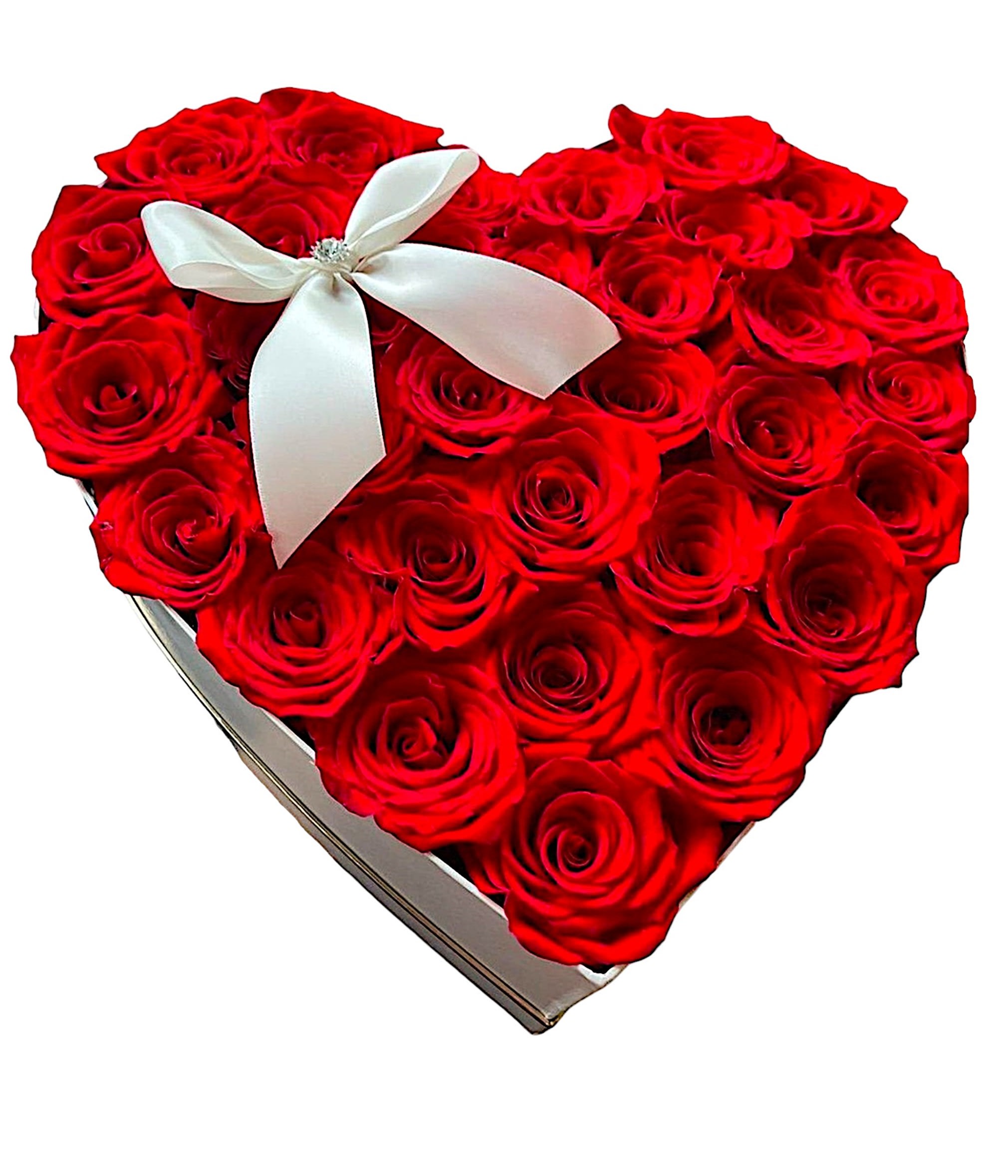 Heart-shaped box filled with red roses and a white ribbon bow