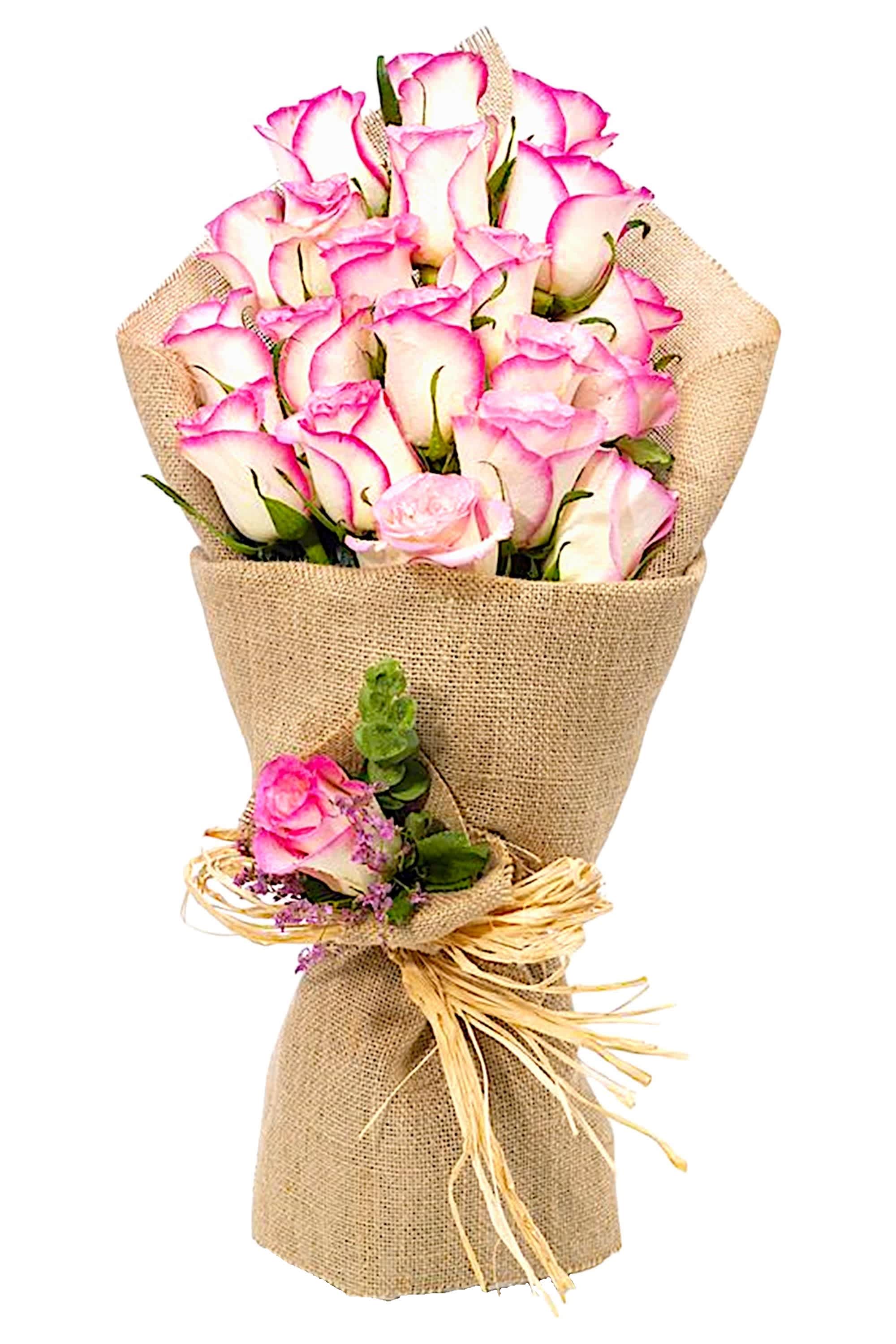 Bouquet of pink-edged white roses wrapped in burlap